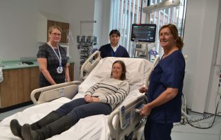 staff with new icu bed with many functions