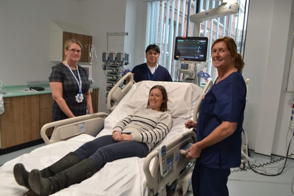 staff with new icu bed with many functions