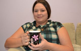 Colette relaxes with a coffee