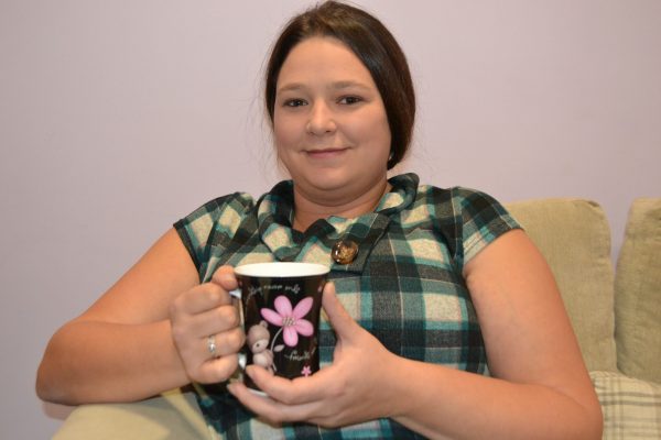 Colette relaxes with a coffee