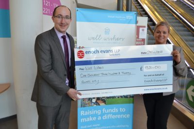 eand hands over a charity chequenoch ev
