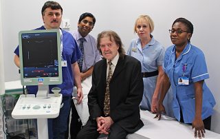 Surgoen Mr Ganta with patient and staff