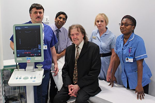 Surgoen Mr Ganta with patient and staff