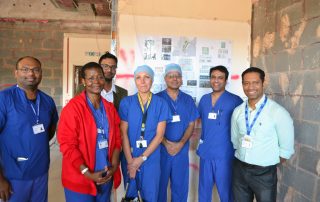 Doctors and nurses gather to see construction of the new ICU