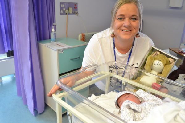 fundraising manager with firts baby born on Christmas day