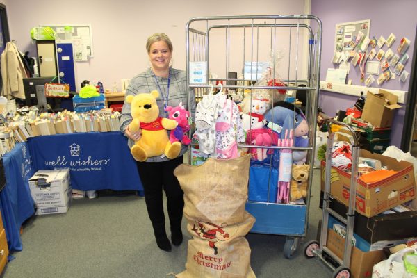 Fundraising manager with toys and gifts donated