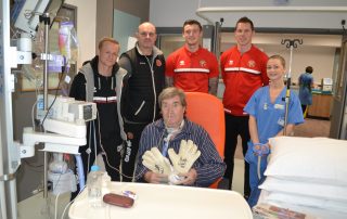 ICU patient Philip received signed goalie gloves