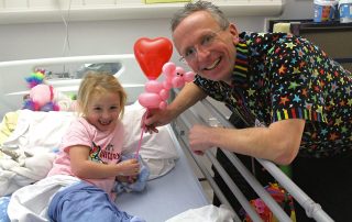 Magic Russ entertains our young patients