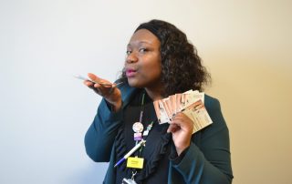 Tracey with fashion show tickets
