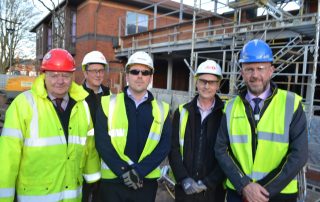 staff outside the obstetrics theatre that is being built