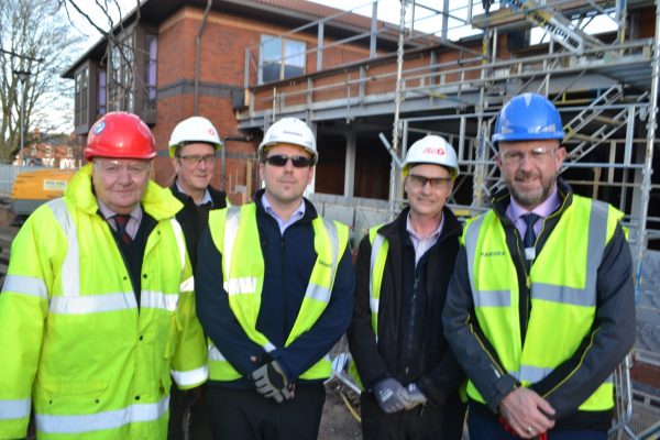 staff outside the obstetrics theatre that is being built