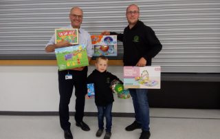 Handing over a bumper haul of toys for young patients