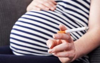 Image of pregnant woman with cigarette