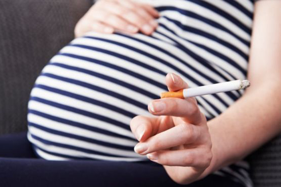 Image of pregnant woman with cigarette