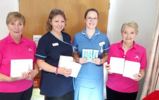 Handing over thermometers to the chemo unit