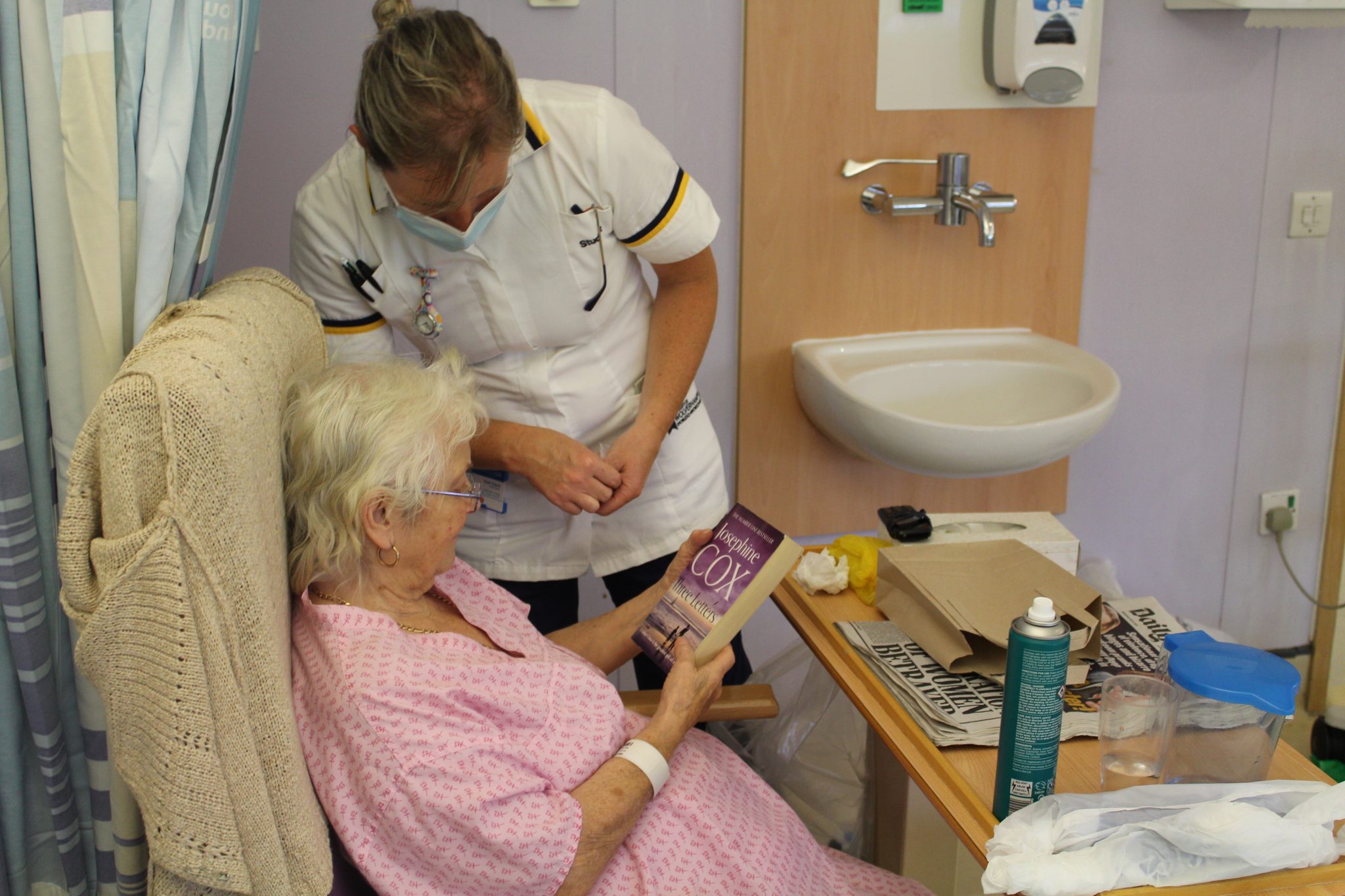 patient holding book