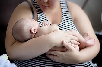 mother holding baby