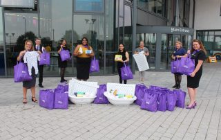West Brom staff hand over goodie bags for new mums