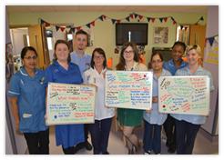 ward 2 team holding boards