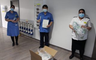 ICU staff holding swabs