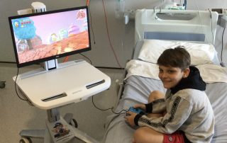 Young patient Jamie playing games