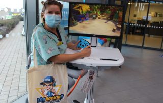 Play Specialist Jo Plank with the mobile gaming unit