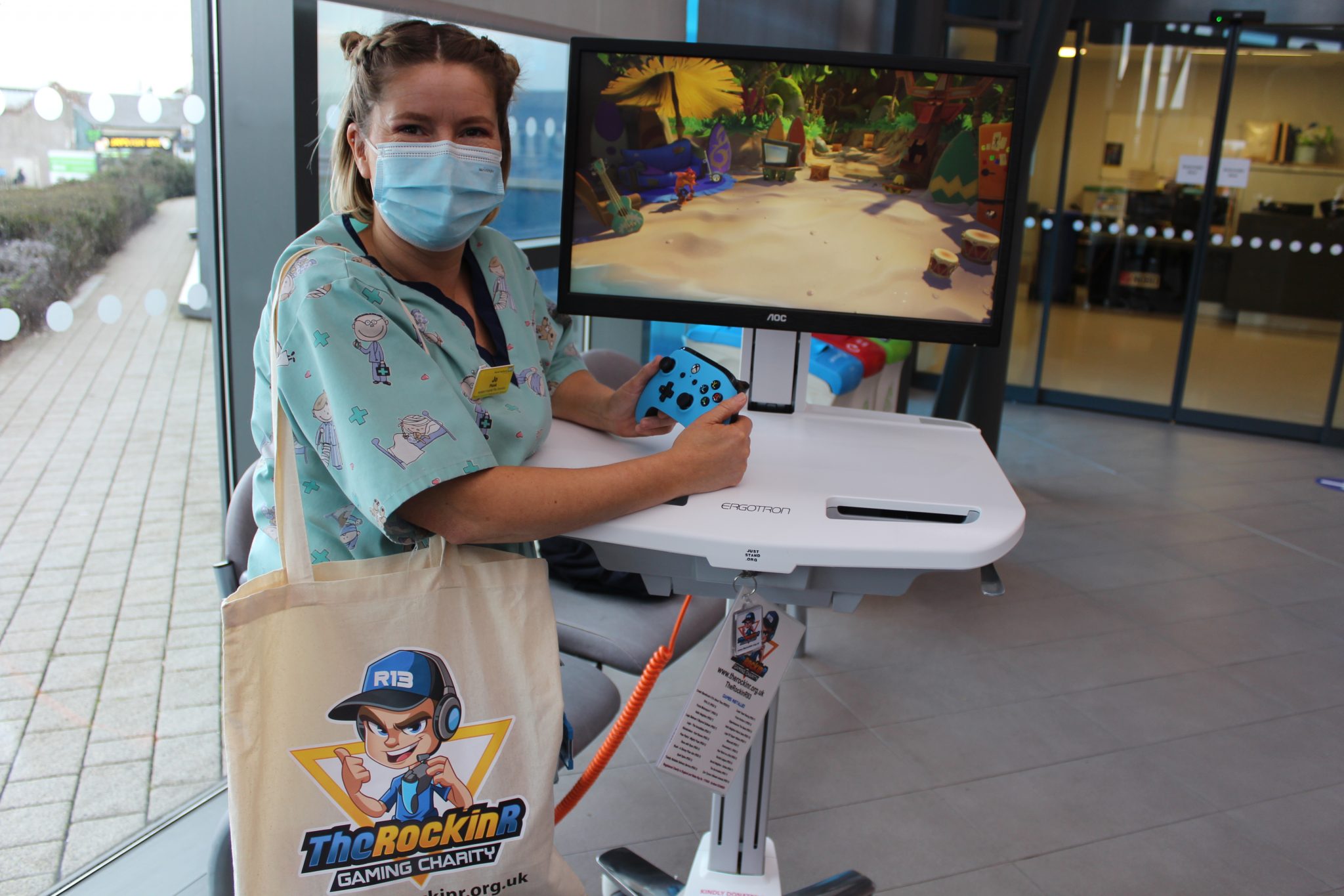 Play Specialist Jo Plank with the mobile gaming unit