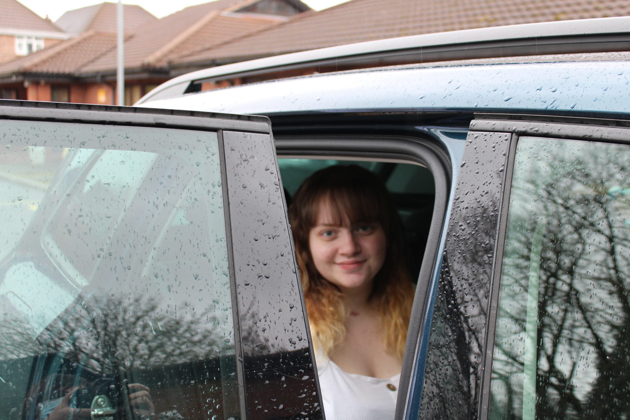 Ellie in the car ready to go home