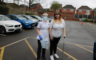 Ellie with physiotherapist Chloe, going home