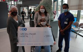 Ellie and her family have handed cheques over to the hospital
