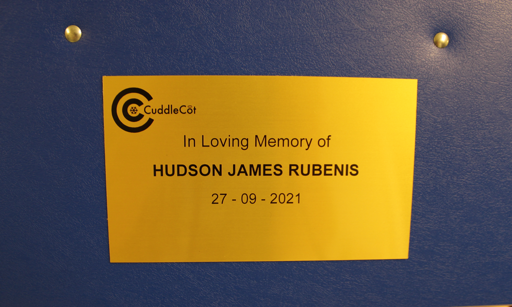 A plaque on the cuddle cot in Hudson's memory