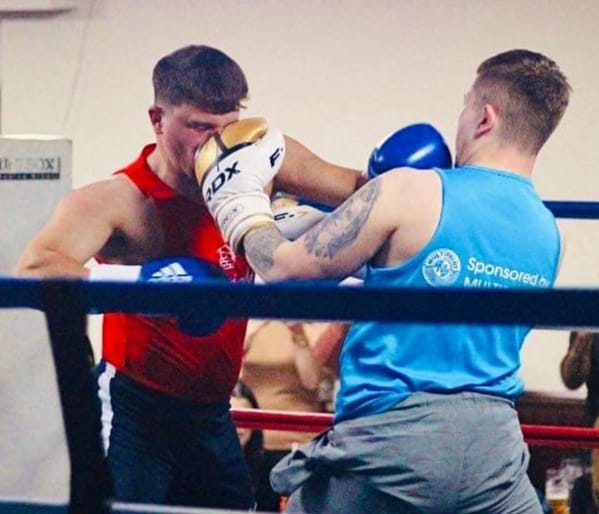 Two boxers in the ring at the charity event