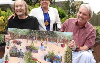 The Mayor of Walsall with a painting of how the garden may look