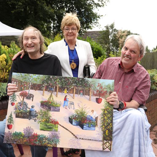 The Mayor of Walsall with a painting of how the garden may look