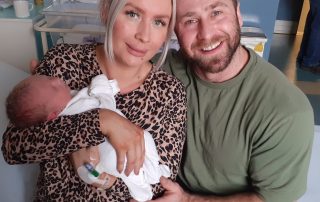 Parents Laura and Dan with Christmas Day baby Cole.