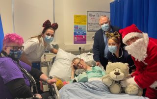 Adrian De Lacy with his family, staff and Santa