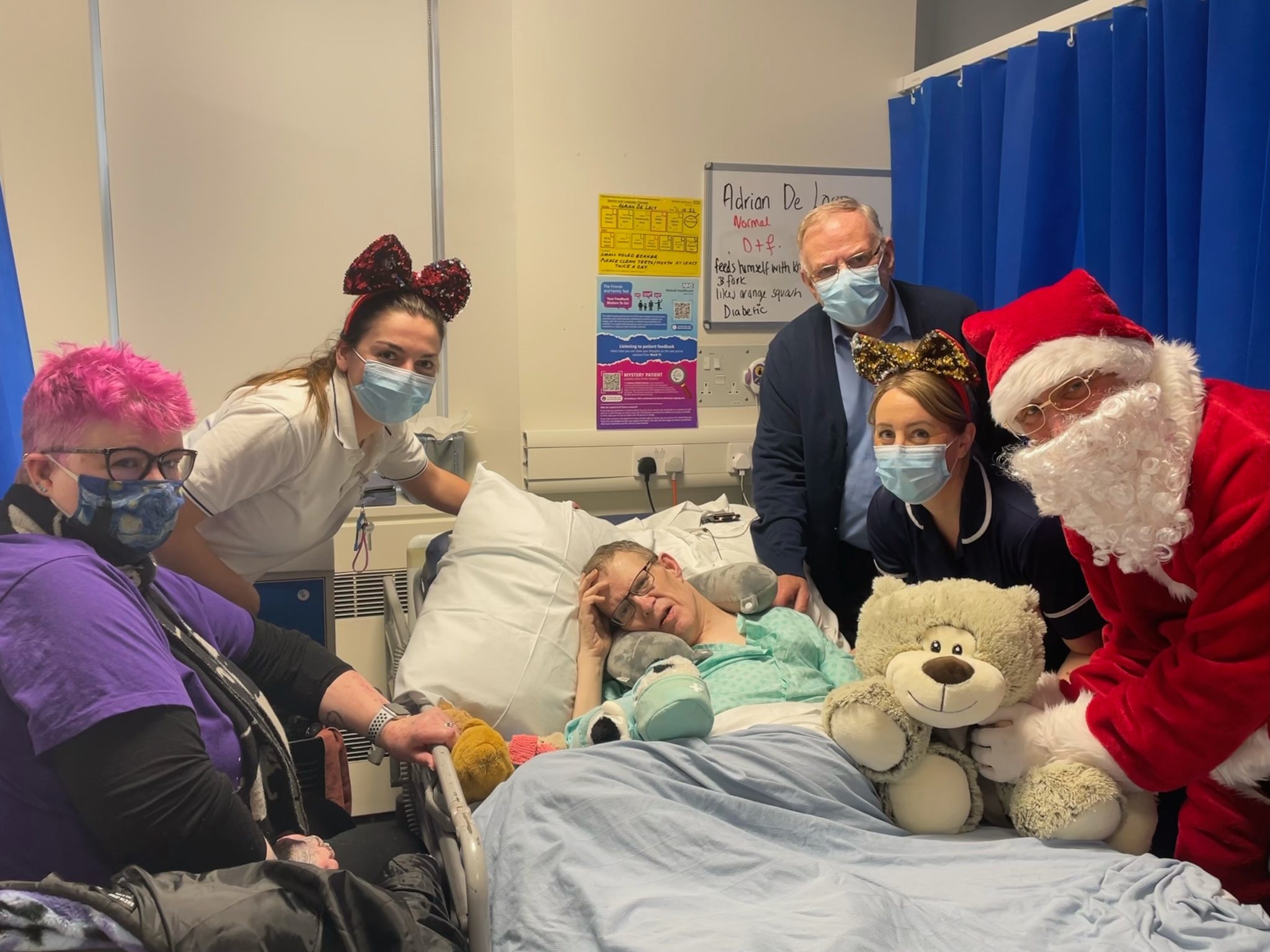 Adrian De Lacy with his family, staff and Santa