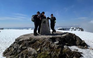 Three of the four climbers at the summit