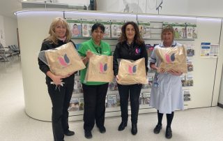 Veronica Kumeta and Shelley Duncan from LFBC alongside Kaz Kaur and Trish Griffiths from Walsall Healthcare NHS Trust, all holding Hugs-in-a-Bag