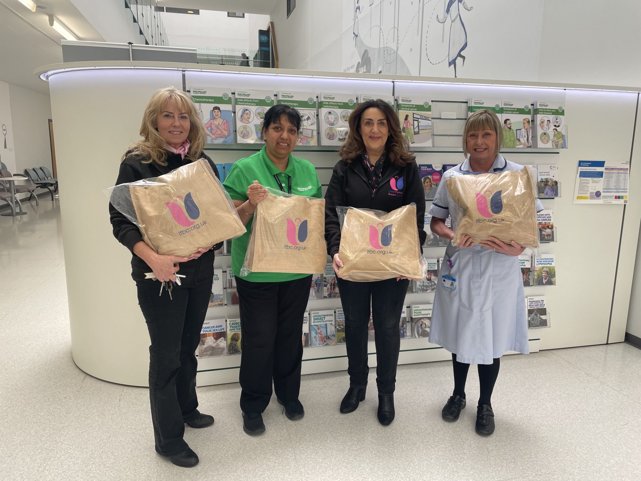 Veronica Kumeta and Shelley Duncan from LFBC alongside Kaz Kaur and Trish Griffiths from Walsall Healthcare NHS Trust, all holding Hugs-in-a-Bag