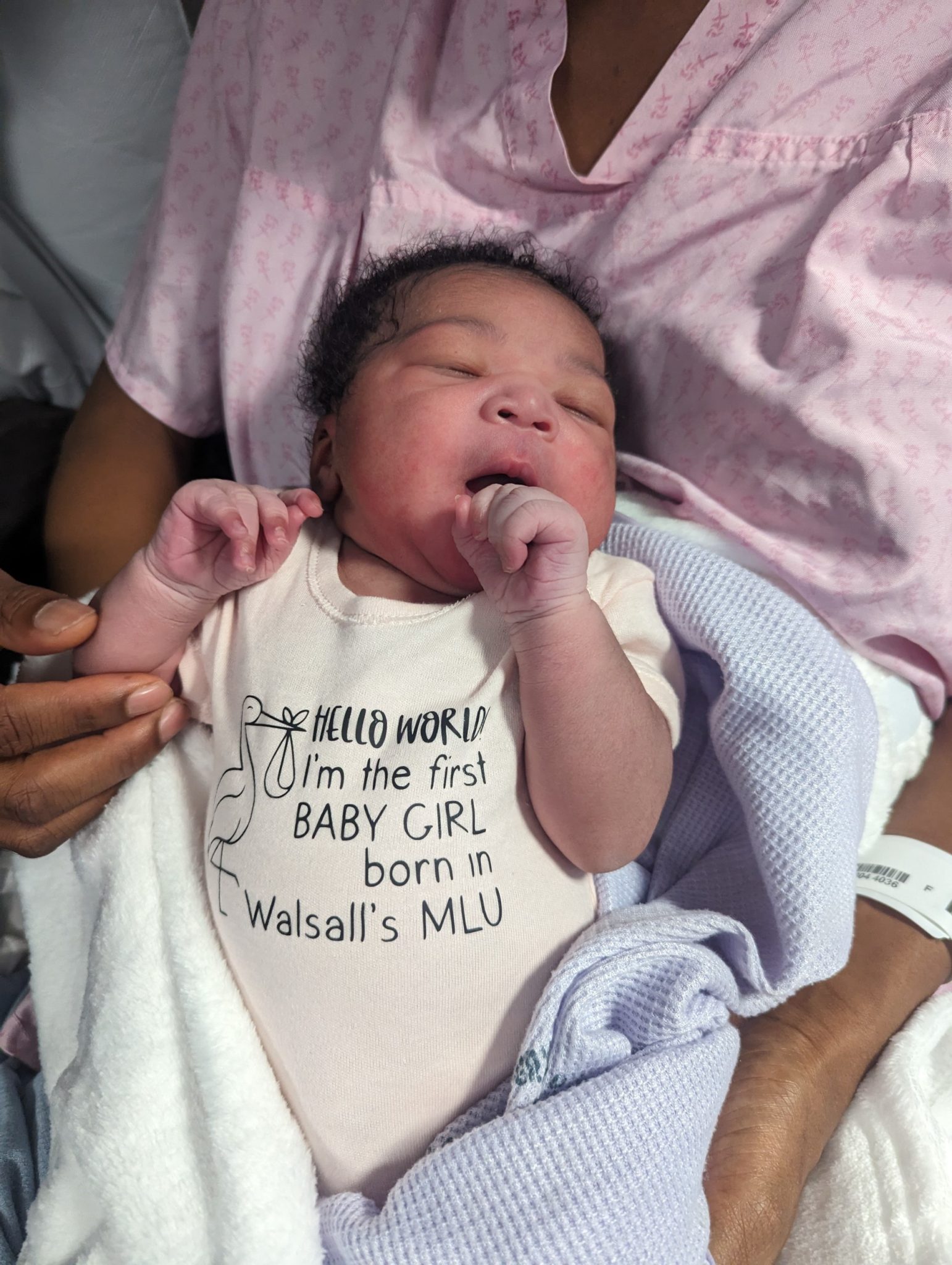 Baby Zadia in her special babygro for being the first baby girl to arrive in the relocated Midwifery-Led Unit