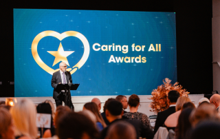Simon Evans, Group Deputy Chief Executive and Group Chief Strategy Officer, opening the Caring for All Awards 2025.