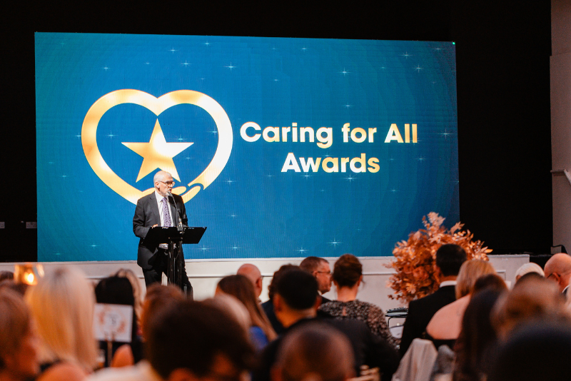 Simon Evans, Group Deputy Chief Executive and Group Chief Strategy Officer, opening the Caring for All Awards 2025.