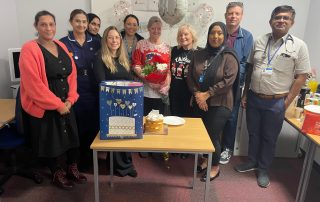 Jenny surrounded by colleagues