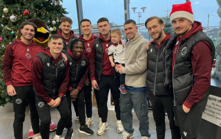 Players at Walsall Football Club visit staff at Walsall Manor Hospital.