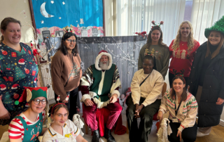Neonatal Outreach Team pose with Santa at Neonatal Christmas party.