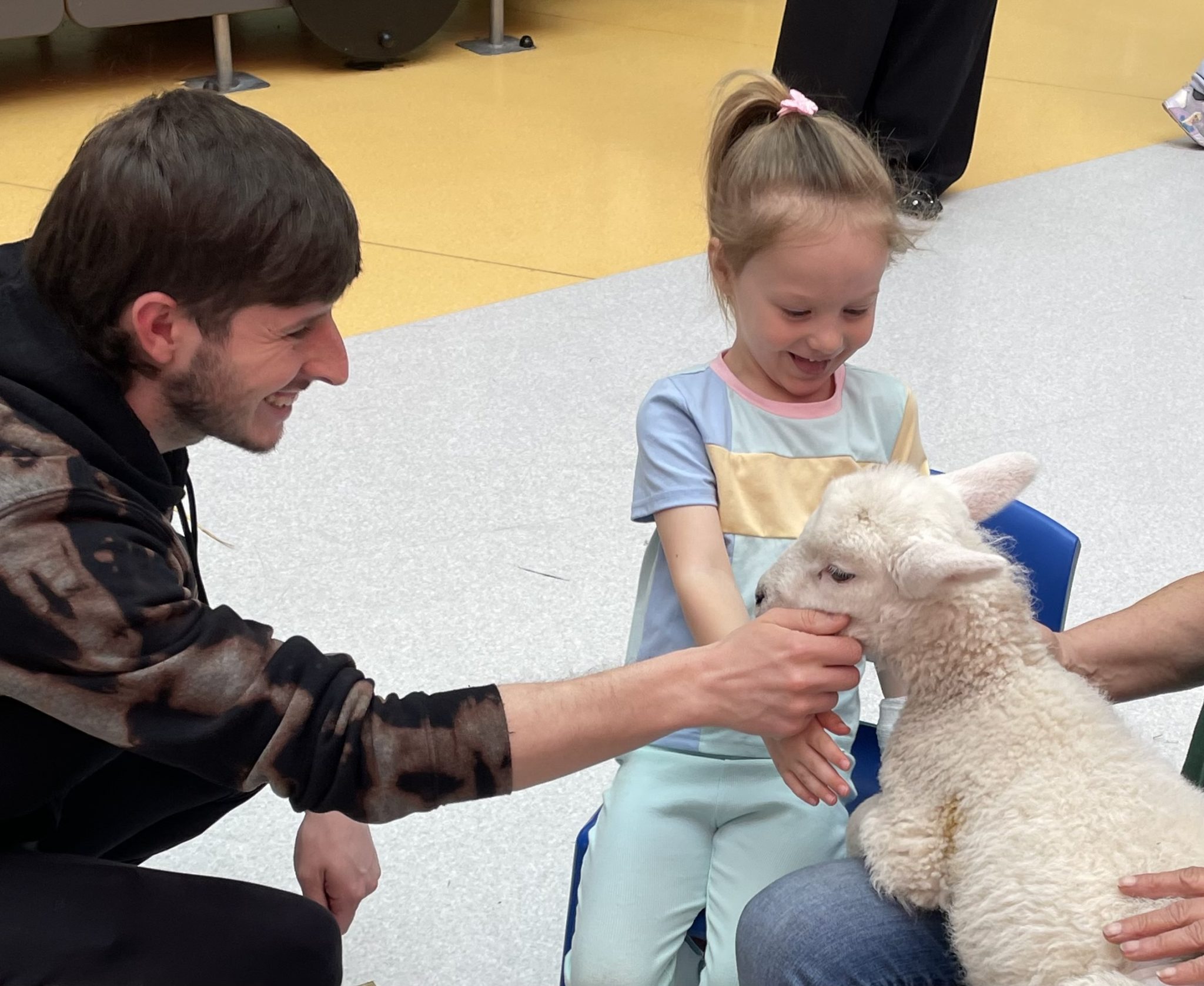 Patient Harlow with a baby lamb.