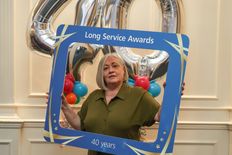 Denise Fraser, Emergency Nurse Practitioner at Walsall, poses for photo with selfie frame.