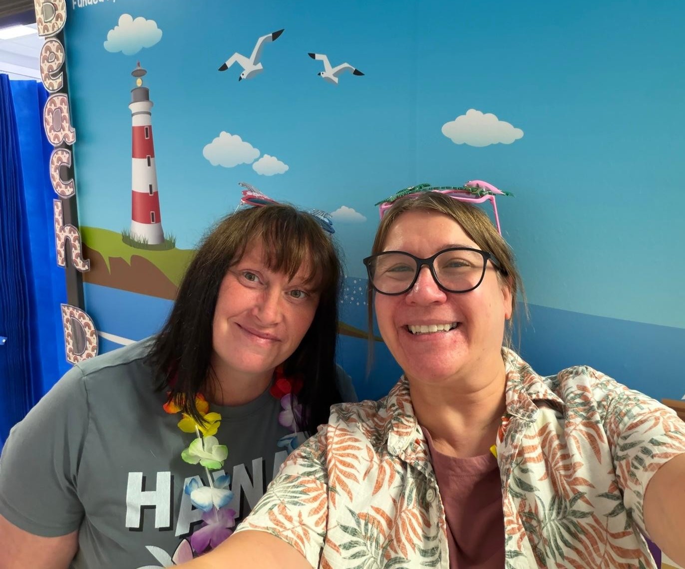 Play Team in front of a seaside mural