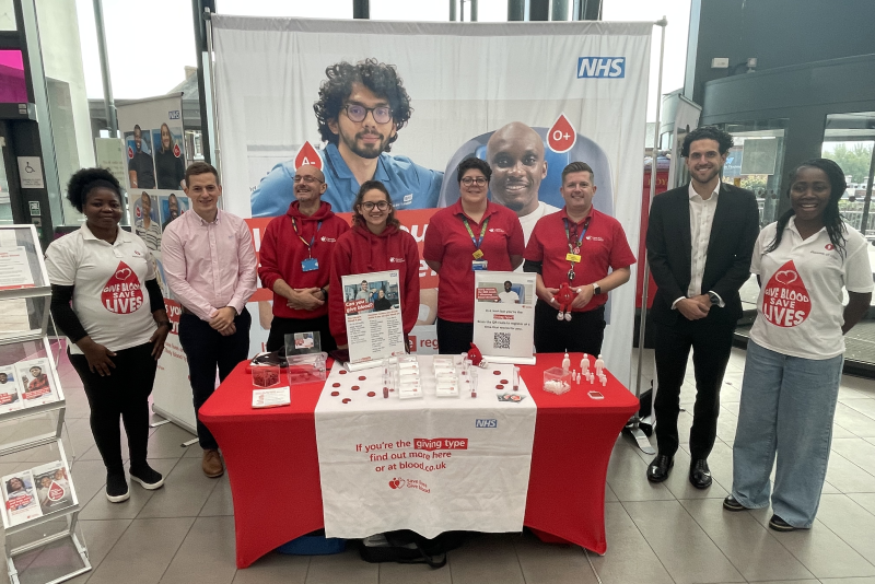 Plasma of Hope charity staff members alongside NHS England Blood and Transplant staff, plus Trust staff - making the 'what's your blood type' event.